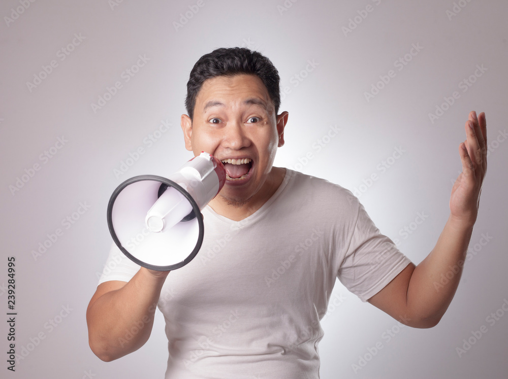 Young Man With Megaphone Advertisement Concept, Smiling Expression Young Man With Megaphone Advertisement Concept, Smiling Expression