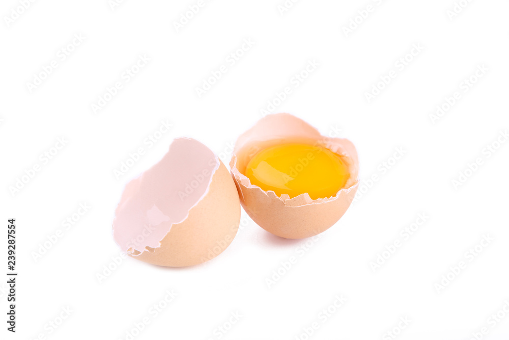 Chicken eggs and half with yolk on a white background. Chicken eggs and half with yolk on a white background.