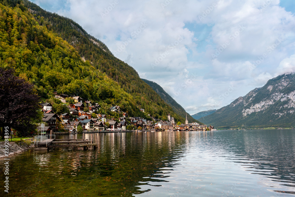 Hallstatt town in Austria with Alpine lake and picturesque mountains around.