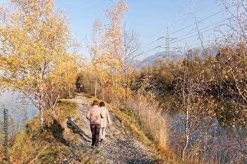 Locals hiking at autumnal banks of Old Rhine