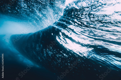 Fototapeta Naklejka Na Ścianę i Meble -  Underwater wave with sun light. Barrel wave crashing in ocean.