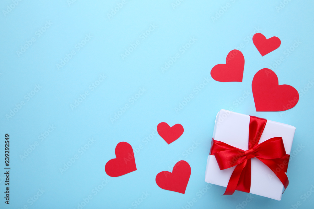 Valentines Day gift with hearts on blue background