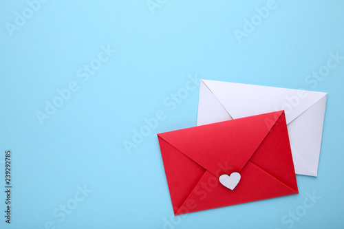 Red and white envelopes on blue background