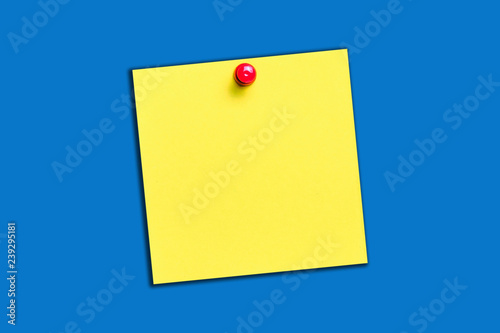 Yellow memo card with red pin. Square note paper. Empty copy space for text message. To do list blank spot.