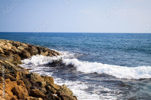 Waves of the Mediterranean Sea crashing on the rocky coast of the island of Cyprus