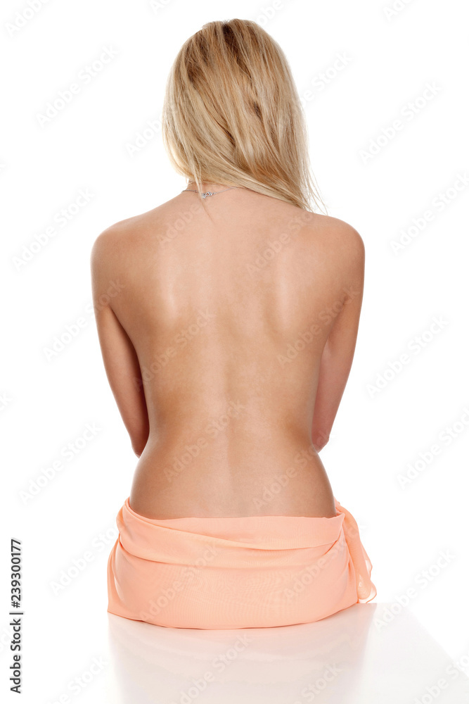 Beautiful female back. Woman with smooth and clear skin posing against  white background, isolated Stock Photo