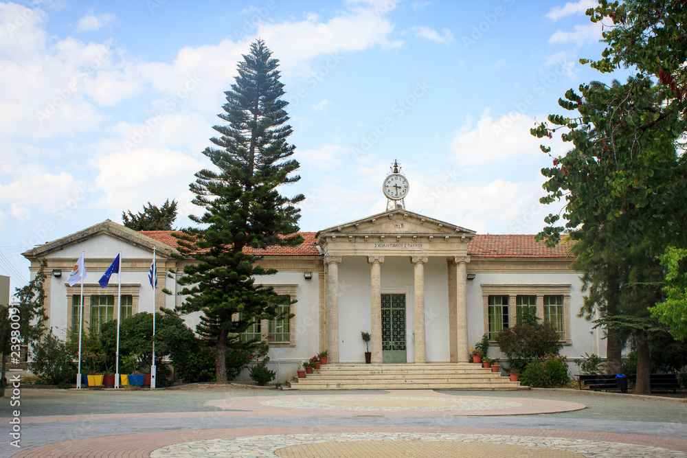 Lefkara Primary School. 1920 - Holy cross school. Beautiful embassy building with antique columns in one of the green squares on the island of Cyprus