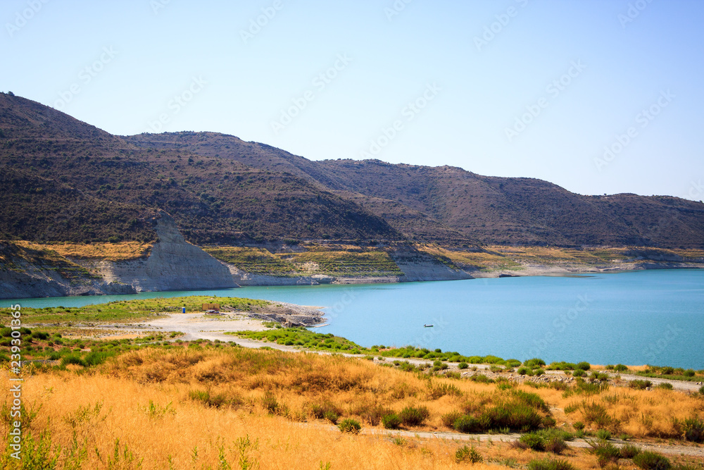 Beautiful view of the blue lake surrounded by mountains on the island of Cyprus