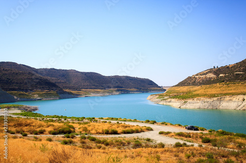 Beautiful view of the blue lake surrounded by mountains on the island of Cyprus