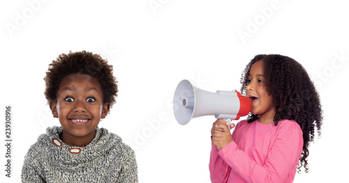Funny childr shouting through a megaphone to his brother