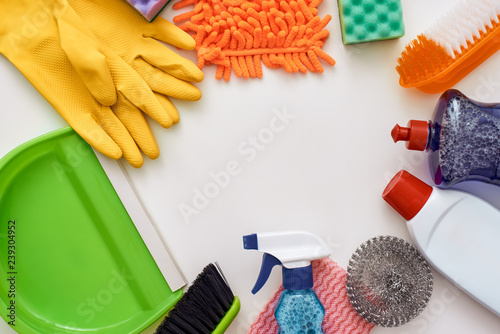 Cleaning tools. Circle from spray bottle and other items isolated photo