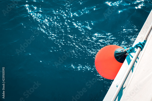 Stampa su tela Coral yacht fender against dark sea