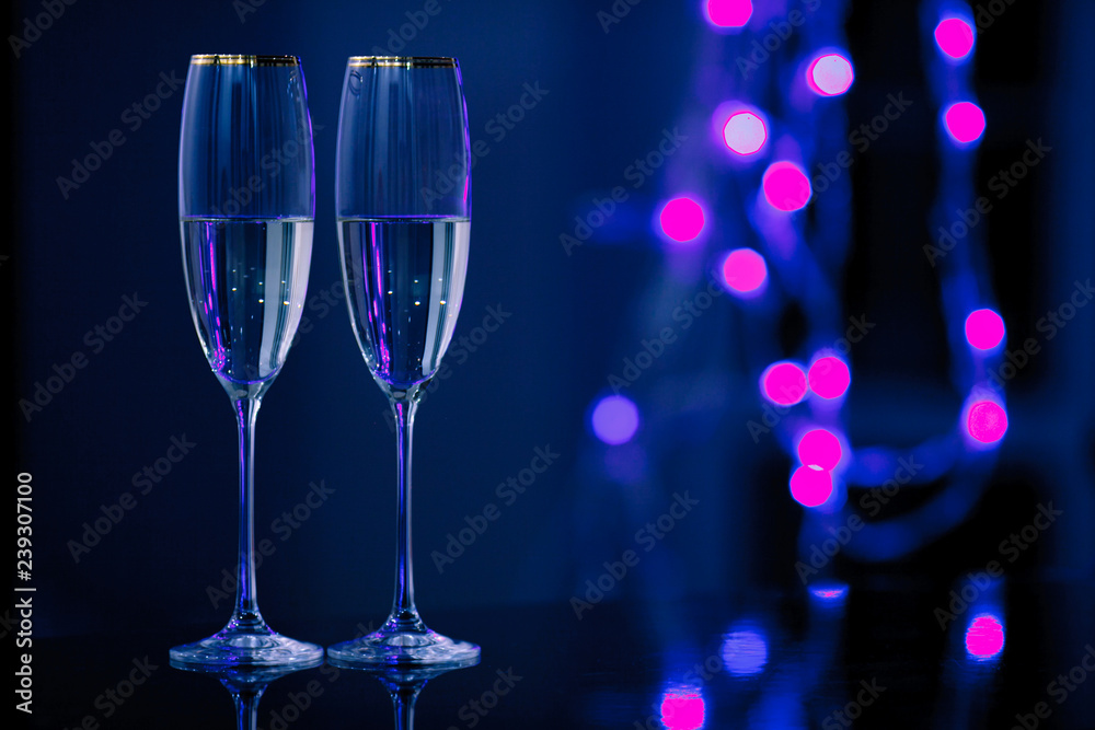 A pair of glasses of champagne in the interior. Holiday's concept. A pair of glasses of champagne in the interior. Holiday's concept.