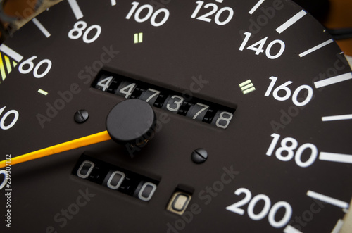 Close up shot of a speedometer in a car. Car dashboard. Dashboard details with indication lamps.Car instrument panel. Dashboard with speedometer, tachometer, odometer. Car detailing. Modern interior