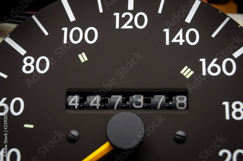 Close up shot of a speedometer in a car. Car dashboard. Dashboard details with indication lamps.Car instrument panel. Dashboard with speedometer, tachometer, odometer. Car detailing. Modern interior