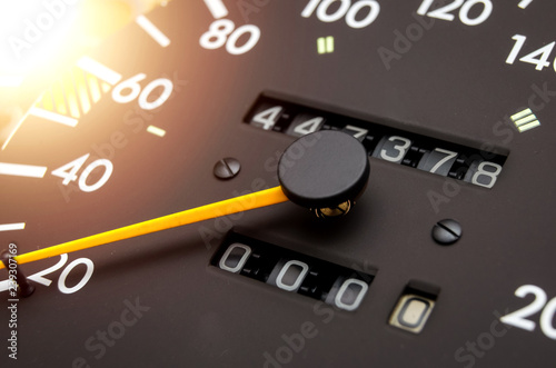 Close up shot of a speedometer in a car. Car dashboard. Dashboard details with indication lamps.Car instrument panel. Dashboard with speedometer, tachometer, odometer. Car detailing. Modern interior