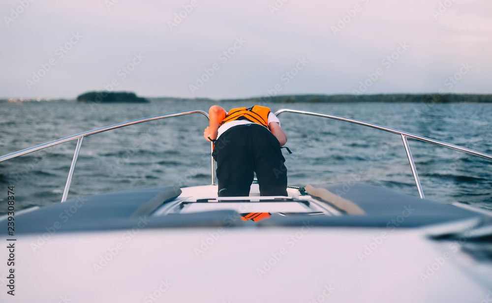 man sick on a yacht at sea. Seasickness. Danger of traveling by boat, swayed.