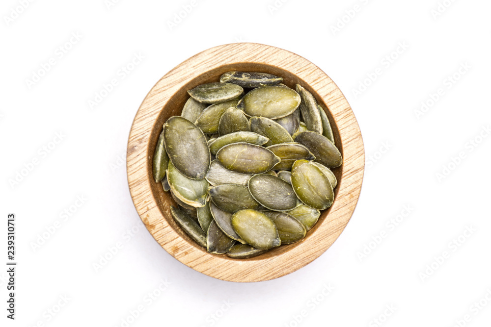 Hulled pumpkin seeds isolated on white Hulled pumpkin seeds isolated on white