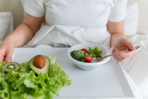 Directly Above Shot Of Woman Having Breakfast On Bed.