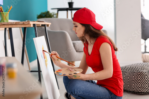 Female artist painting pict...