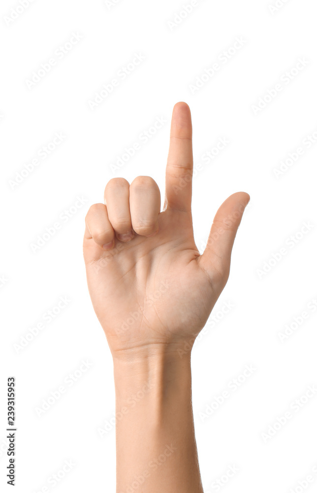 Female hand with raised index finger on white background Female hand with raised index finger on white background