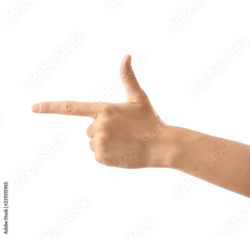 Female hand pointing at something on white background