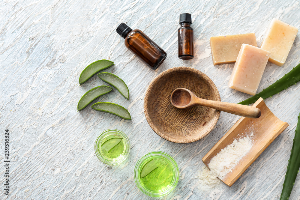 Fresh aloe with cosmetic products on light table Fresh aloe with cosmetic products on light table
