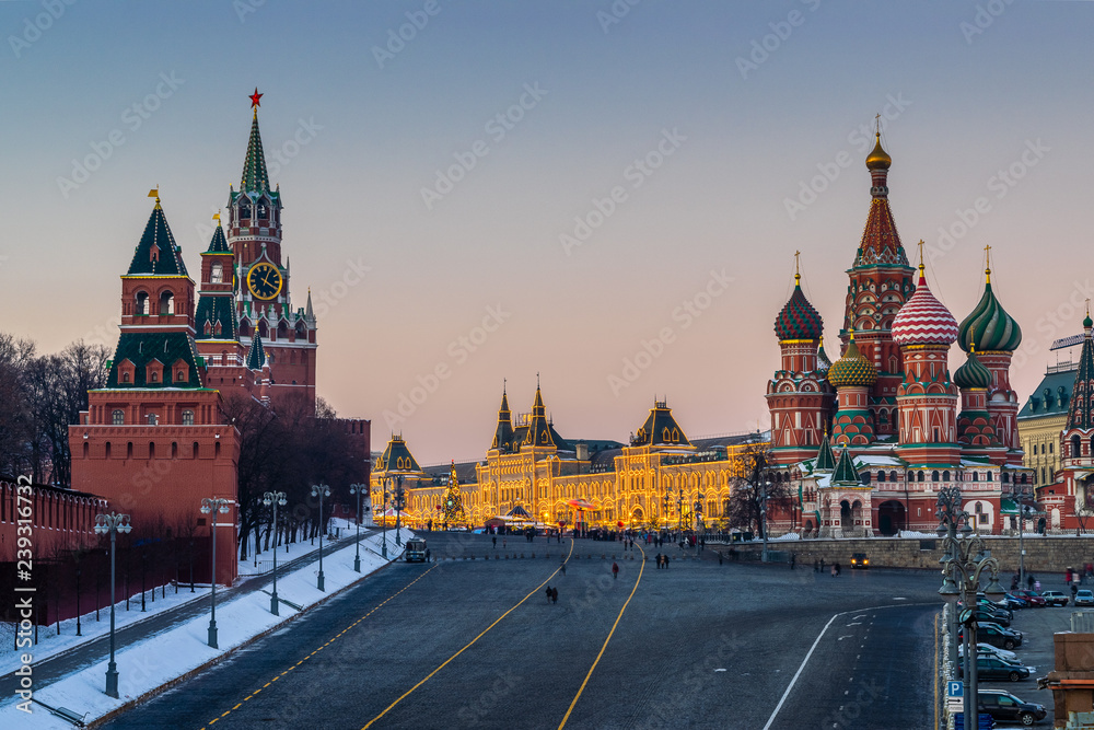 A view of Kremlin, St. Basil Cathedral,  Vasilevsky Descent and Red Square with Christmas and New Year decoration at sunset. Moscow, Russia