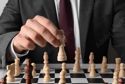 Businessman playing chess, closeup