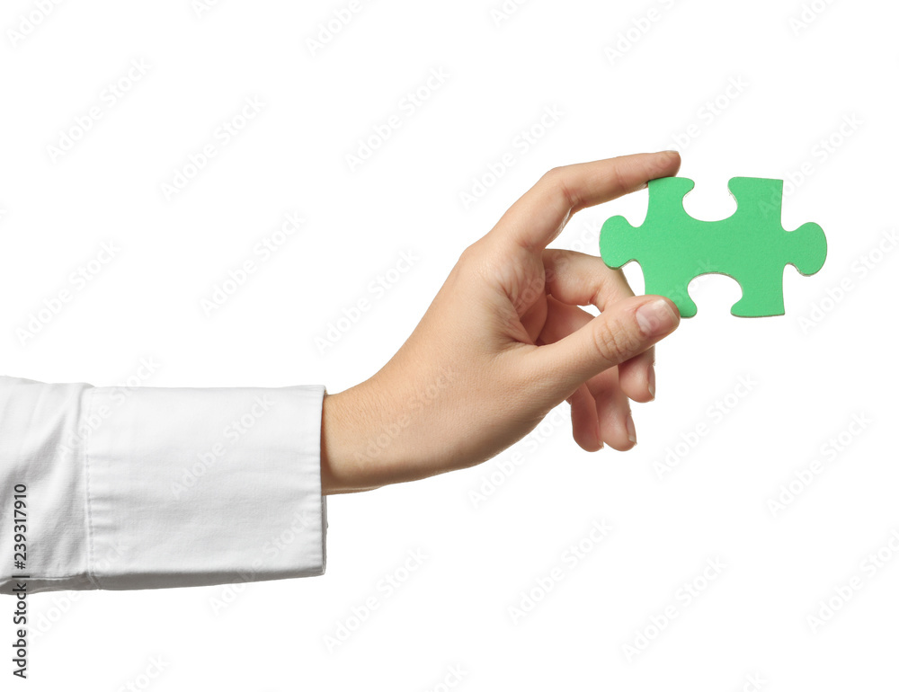 Woman with piece of color puzzle on white background Woman with piece of color puzzle on white background