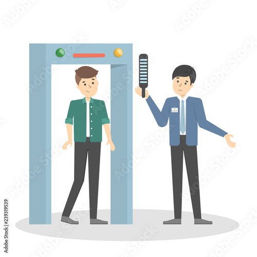 Man going through the metal scanner. Security control