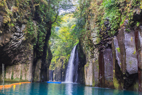 Travelers on a rowing boat at takachiho gorge in a Leaves color change season,Miyazaki,Japan