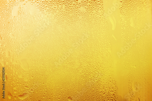 Water vapor in cold Drops of water on a glass of beer , droplets Misted abstract pattern texture background.