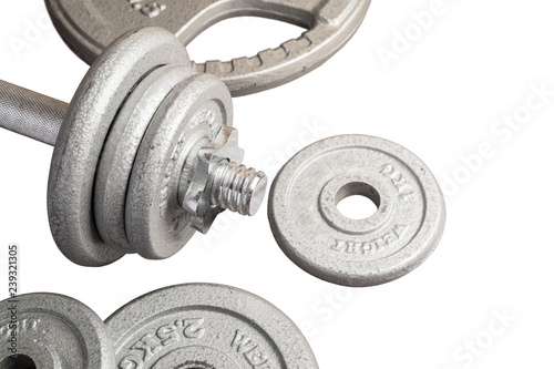 Dumbbell and Metal Weight Plates on the iSolated White Background