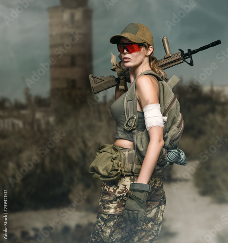 military girl with automatic rifle. Dooms day