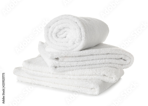 Stack of clean soft towels on white background