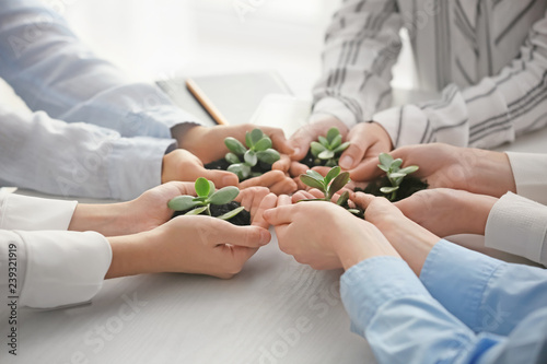Business people holding gre...