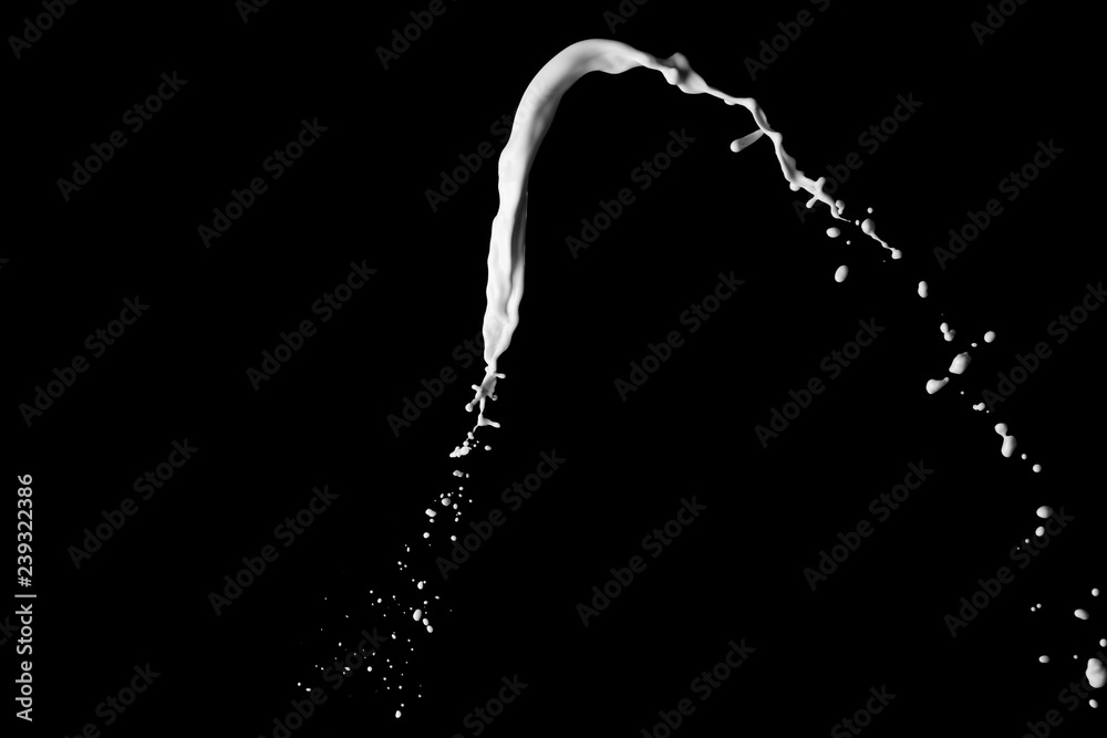 Splash of milk on black background Splash of milk on black background