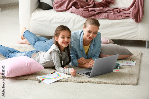 Cute girl with mother doing...