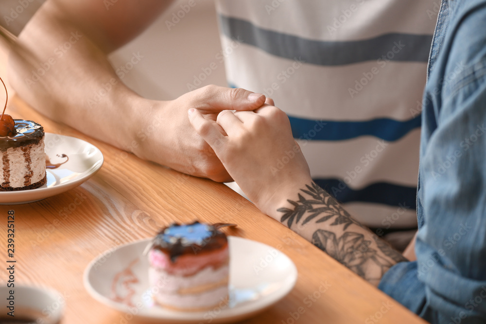 Loving young couple during romantic date in cafe Loving young couple during romantic date in cafe