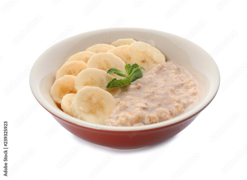 Tasty oatmeal with banana slices in bowl on white background Tasty oatmeal with banana slices in bowl on white background