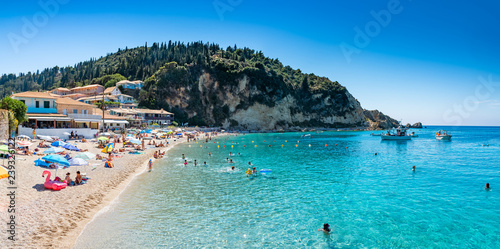 Fototapeta Naklejka Na Ścianę i Meble -  People in summer holiday on the seaside of Agios Nikitas beach, in Lefkada island of Greece - Europe