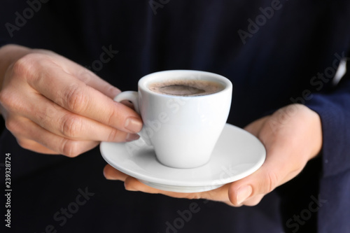 Woman with cup of tasty aromatic coffee, closeup