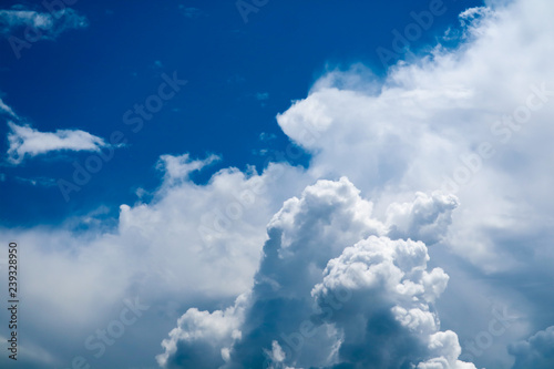 Beautiful heap clouds with clear blue sky and sunlight