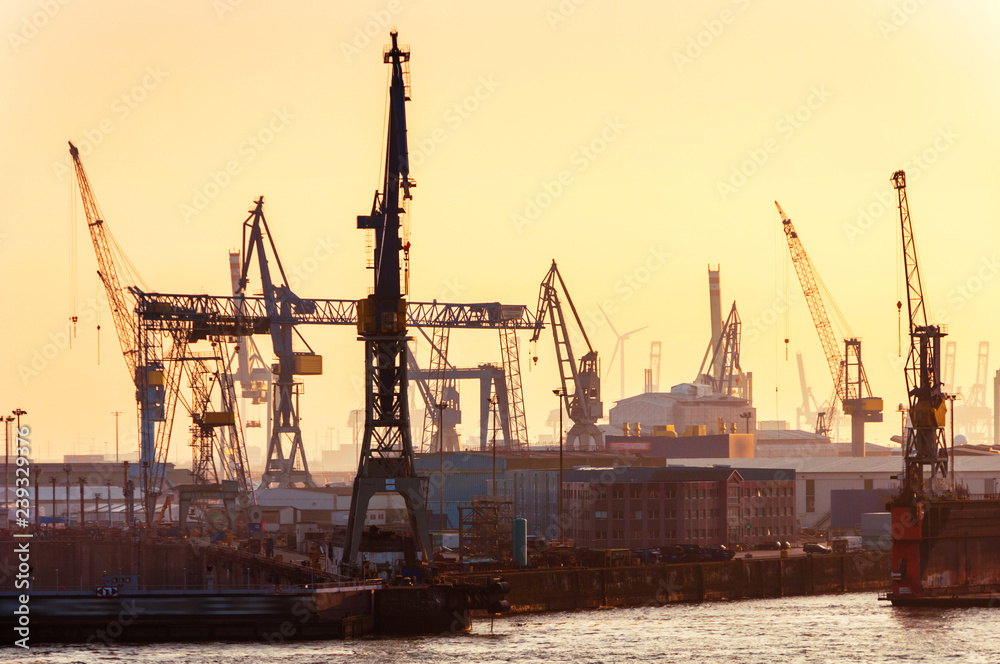Port of Hamburg on the river Elbe in Germany in the evening Port of Hamburg on the river Elbe in Germany in the evening