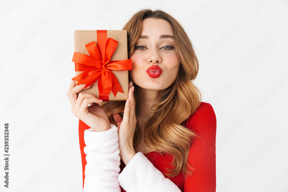 Fototapeta premium Beautiful emotional woman in christmas costume holding present gift box.