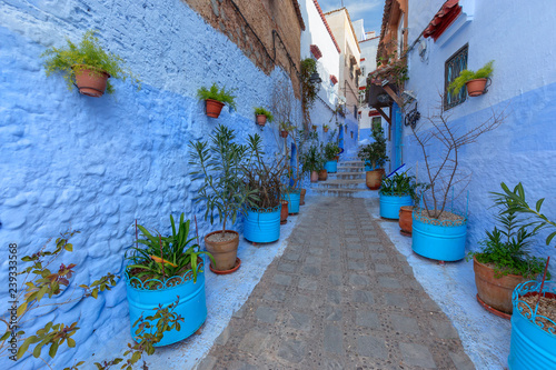 Blue street with color pots in Chefchaouen