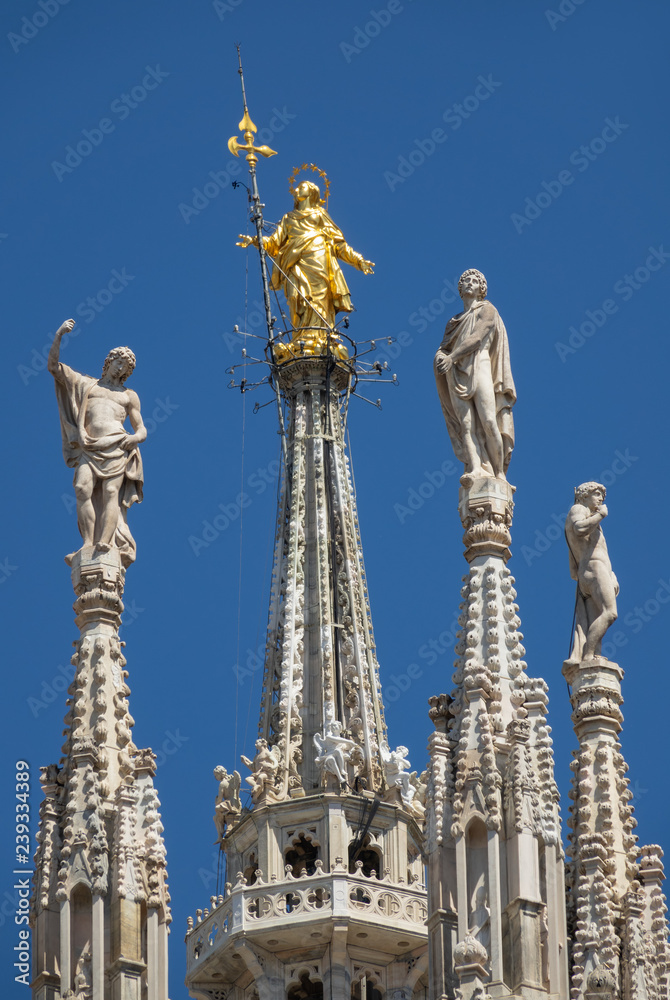 Statues on top of roof cathedral in Milan