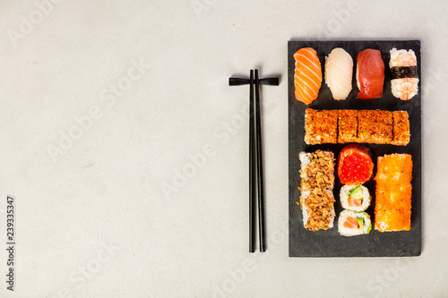 Flat-lay of sushi set, space for text