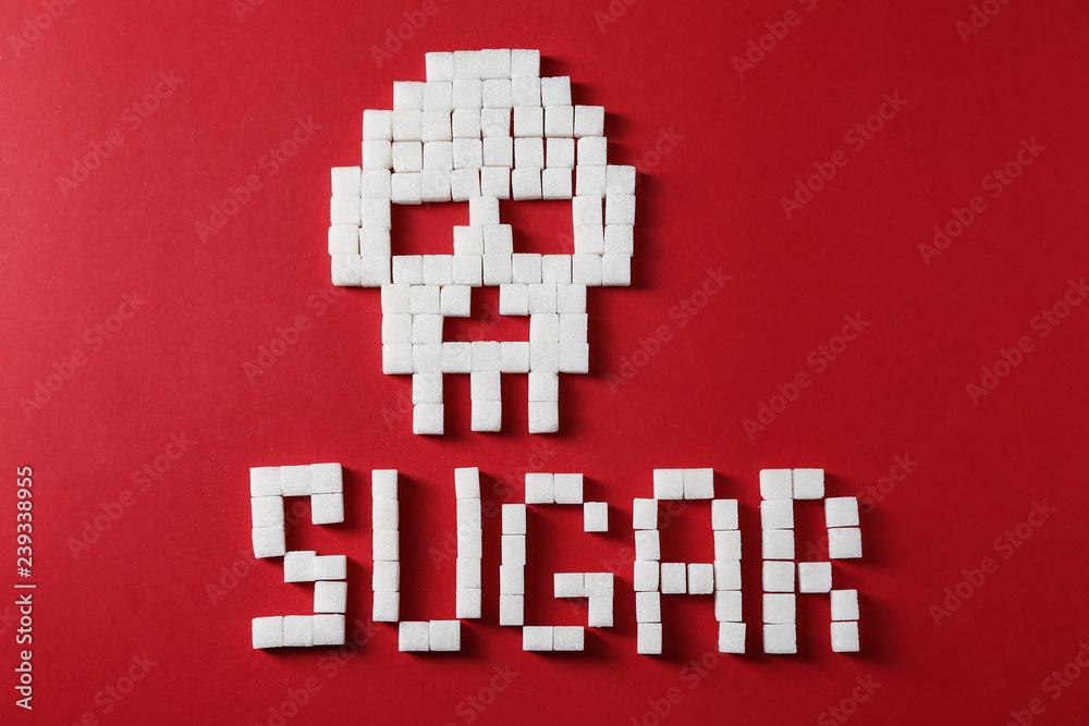 Naklejka premium Word SUGAR with skull on color background